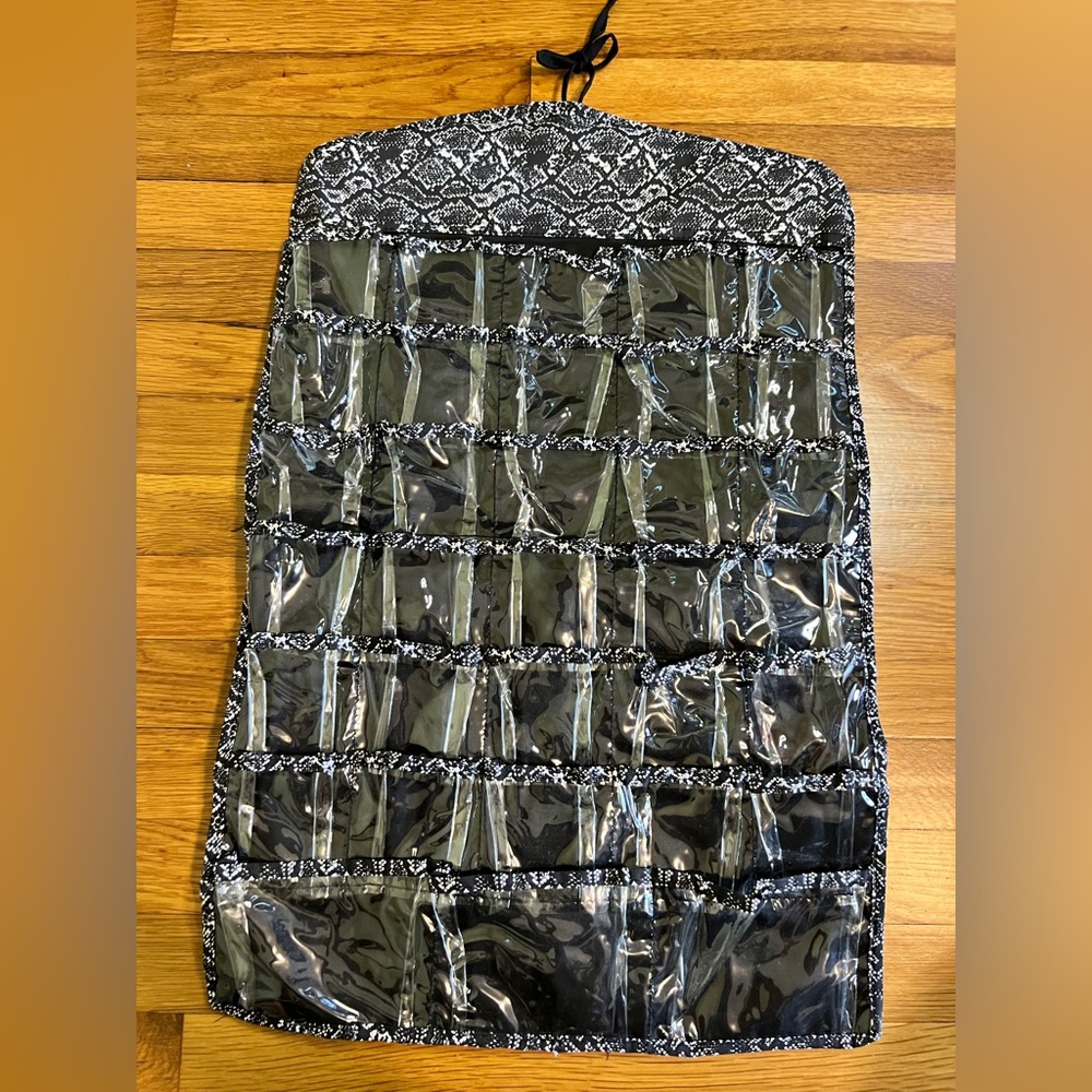 Jewelry organizer. Multi pocketed and double sided.